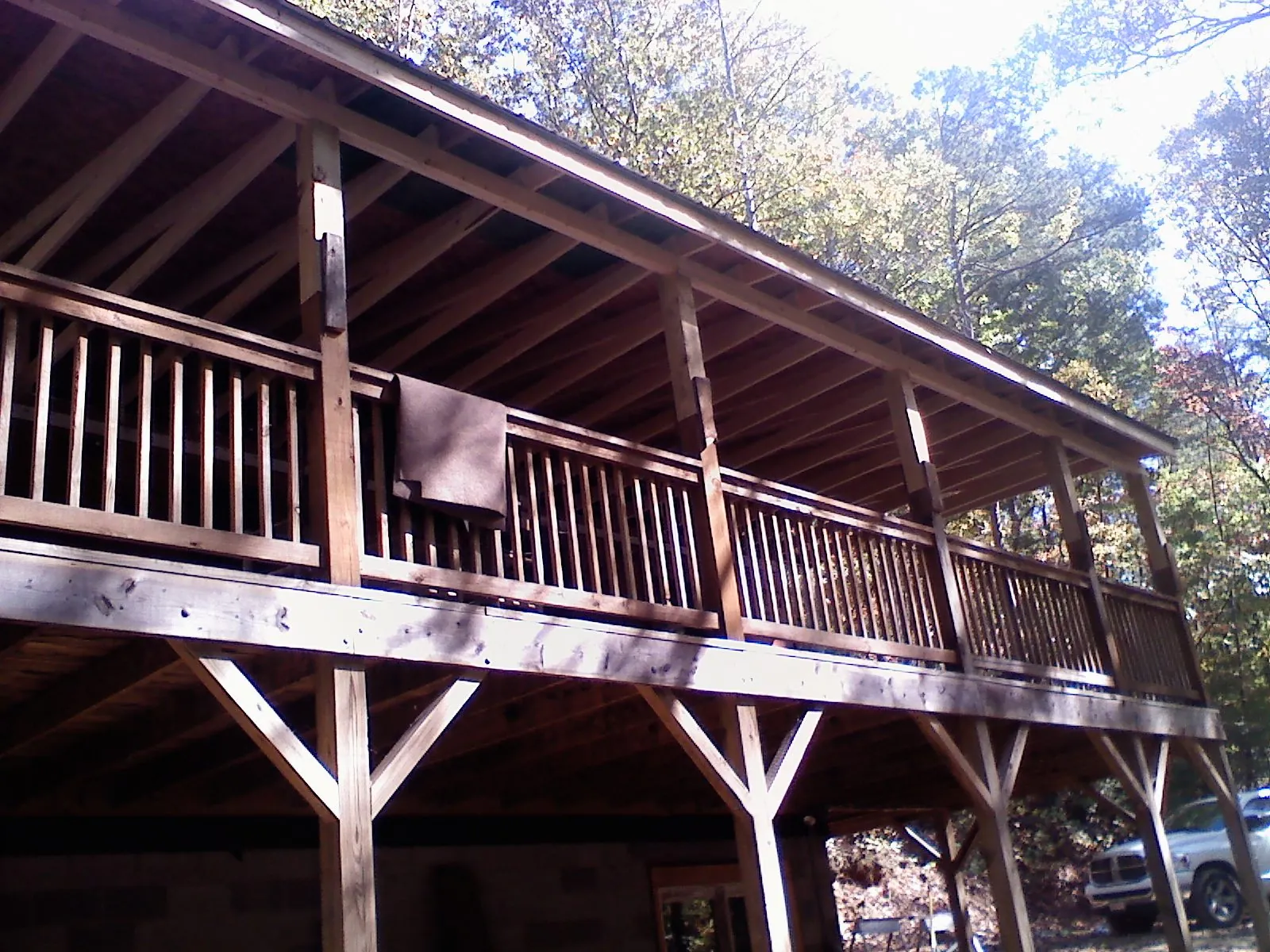 Timber framing under a new elevated porch and deck — Roof Leak Repair in La Prairie by Roofing Brothers